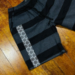 BLACK AND WHITE SPIRAL WALKING SHORTS